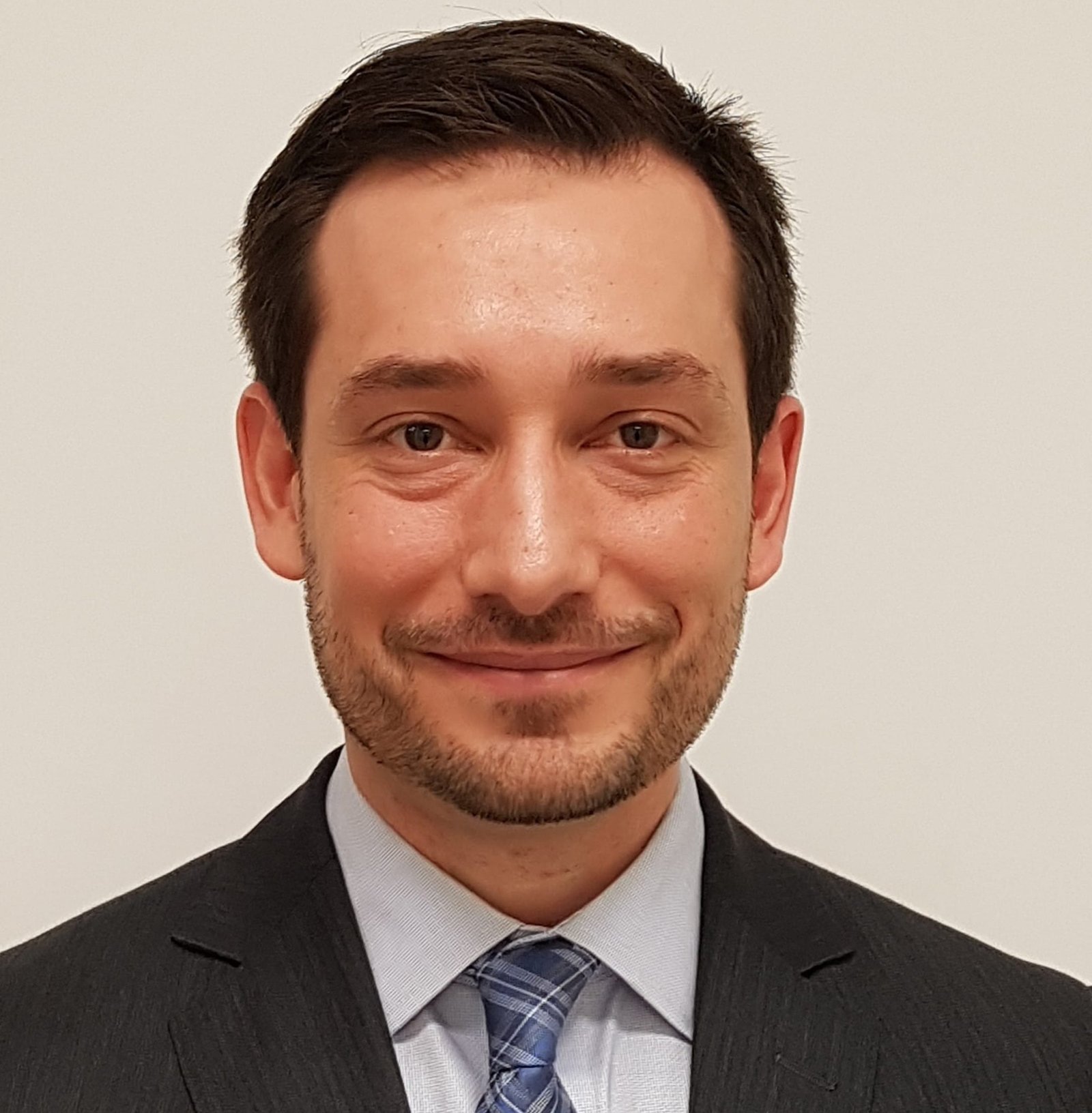 head and photo of Dr Trevor Lewis